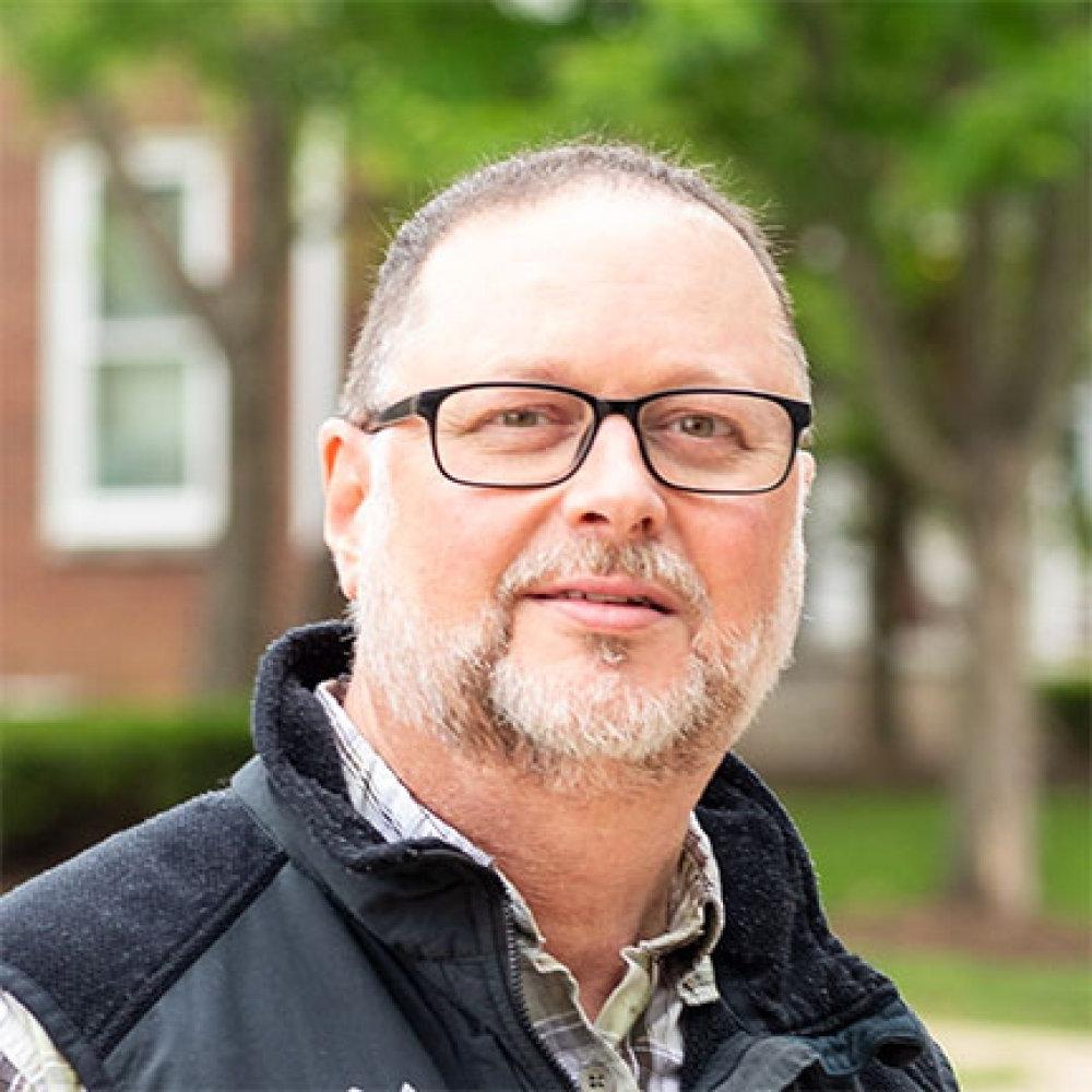 Person wearing glasses and smiling